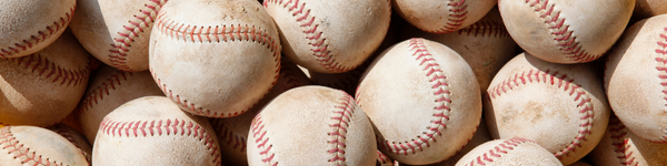 Picture of lots of baseballs in a pile