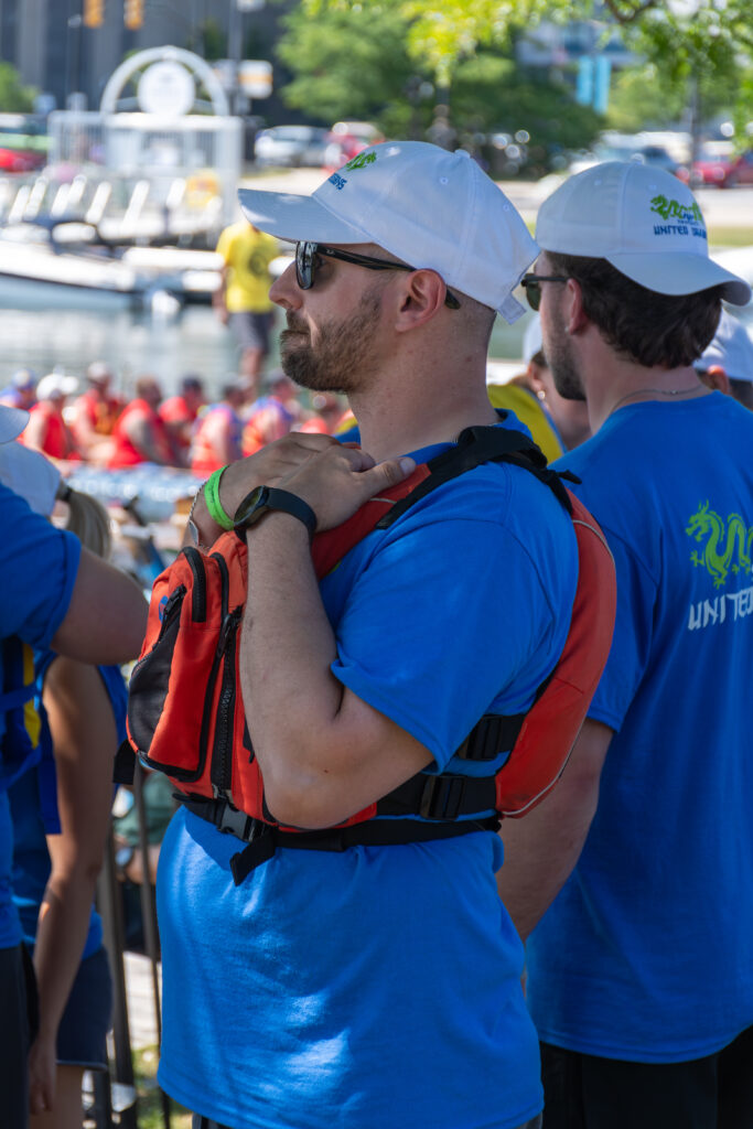 Picture of a man wearing a life jacket and sunglasses