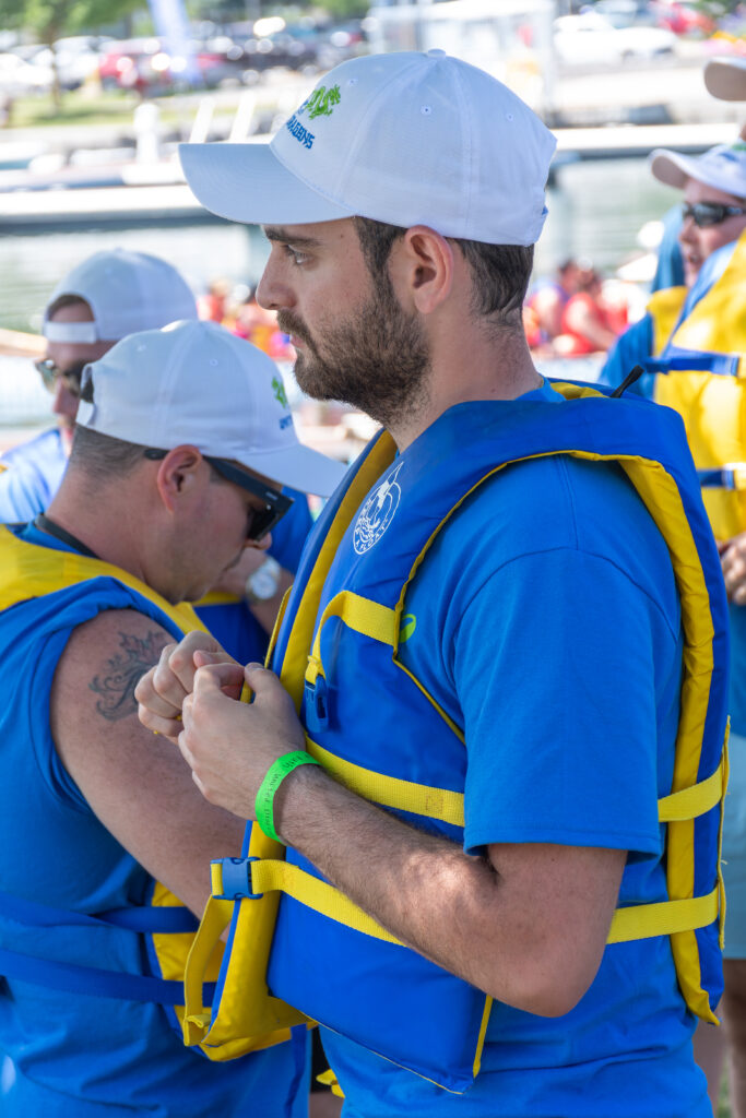 Picture of a man wearing a life jacket and sunglasses