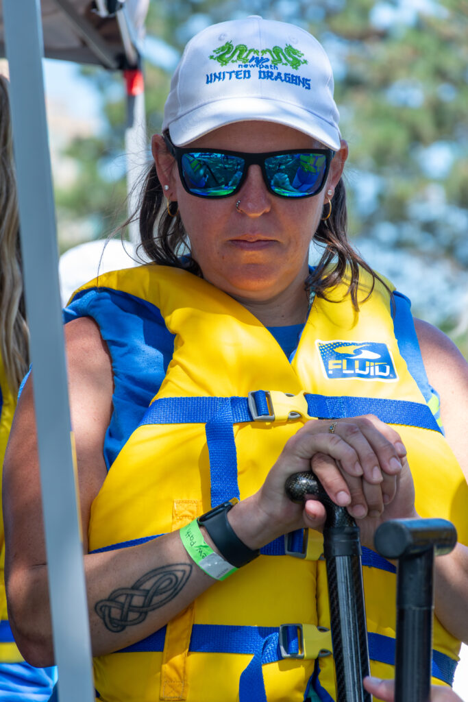 Picture of a woman wearing a life jacket and sunglasses