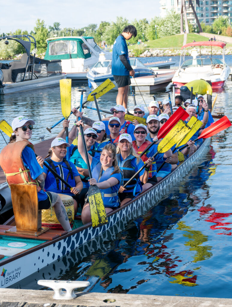 A dragon boat team paddling