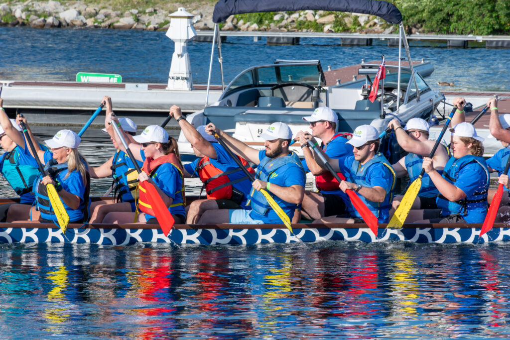 A dragon boat team paddling