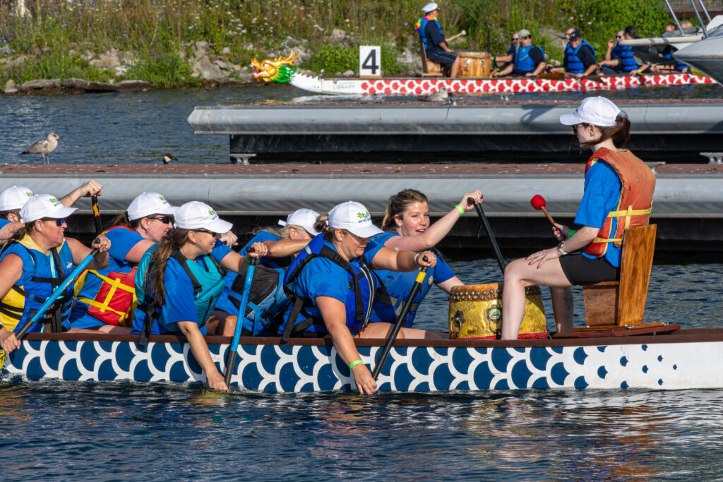 A dragon boat team paddling