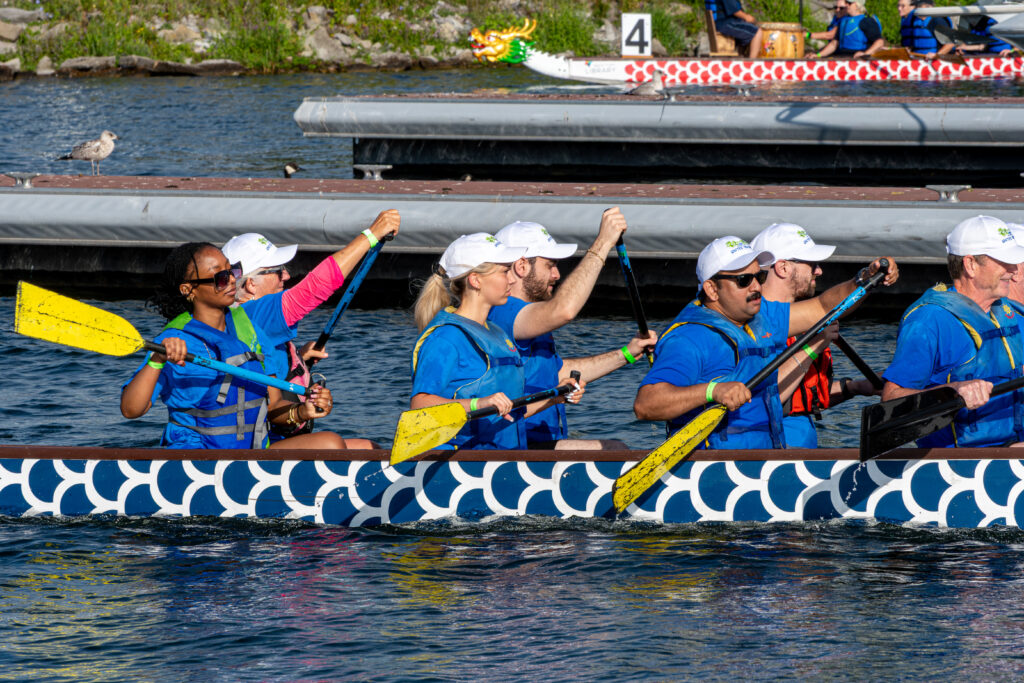 A dragon boat team paddling