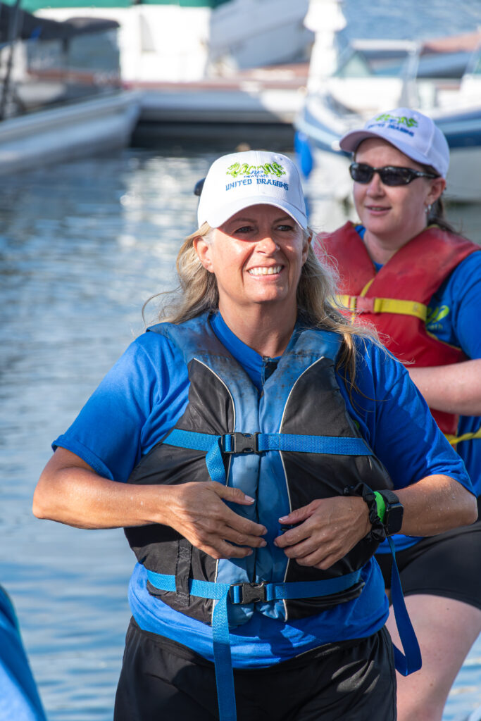 Picture of a woman smiling in a Dragon Boat