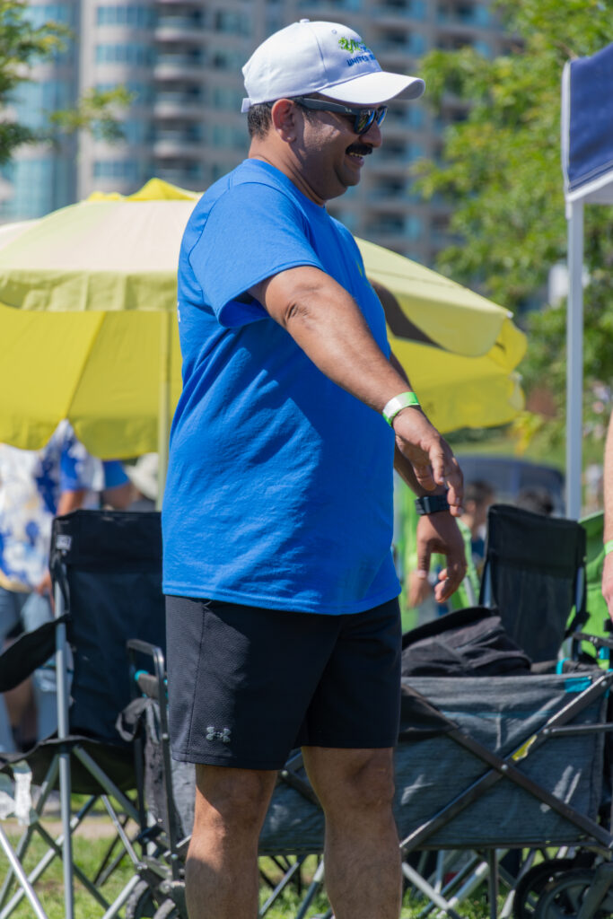 Picture of a man wearing a New Path United Dragon hat and t-shirt smiling