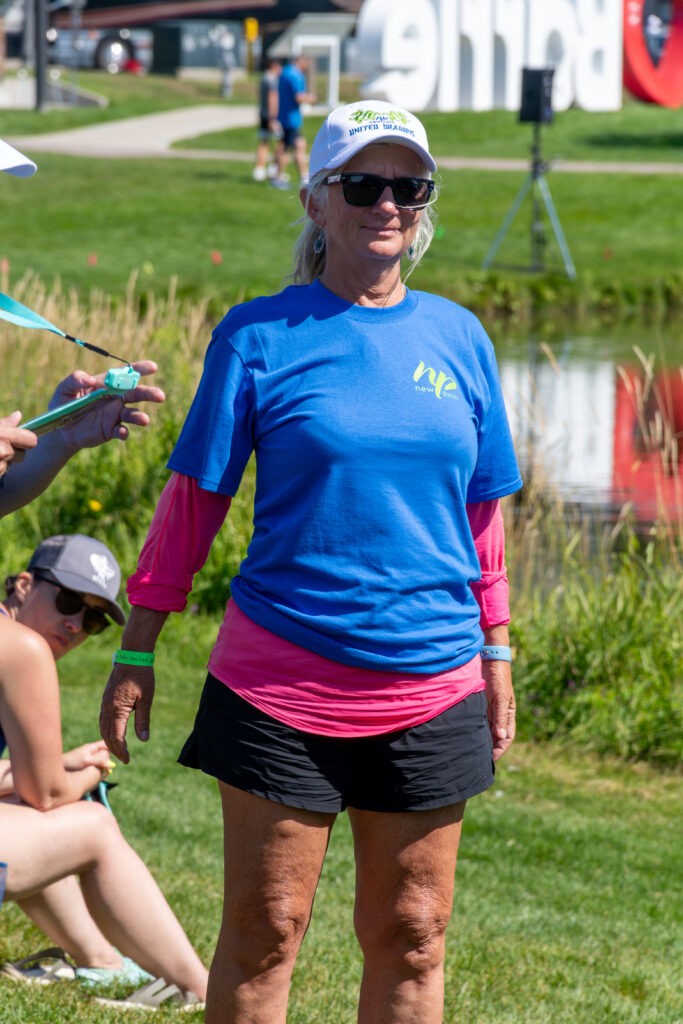 Picture of a man wearing a New Path United Dragon hat and t-shirt smiling