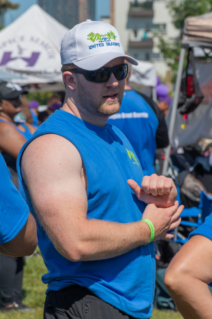Picture of a man wearing a New Path United Dragon hat and t-shirt smiling