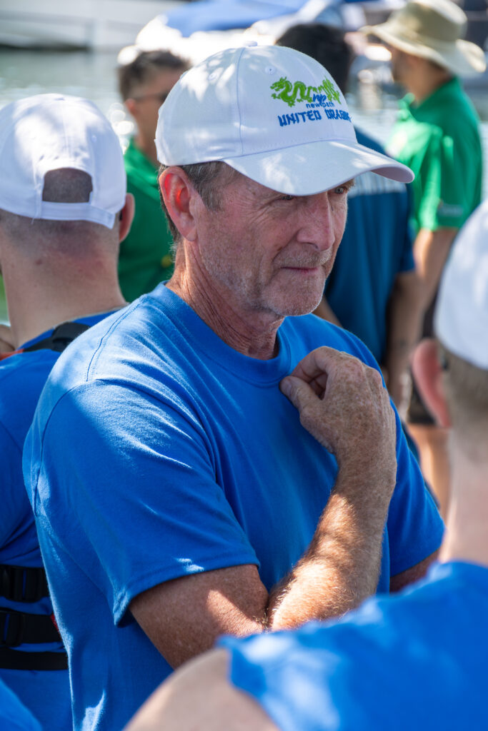 Picture of a man wearing a New Path United Dragon hat and t-shirt looking serious