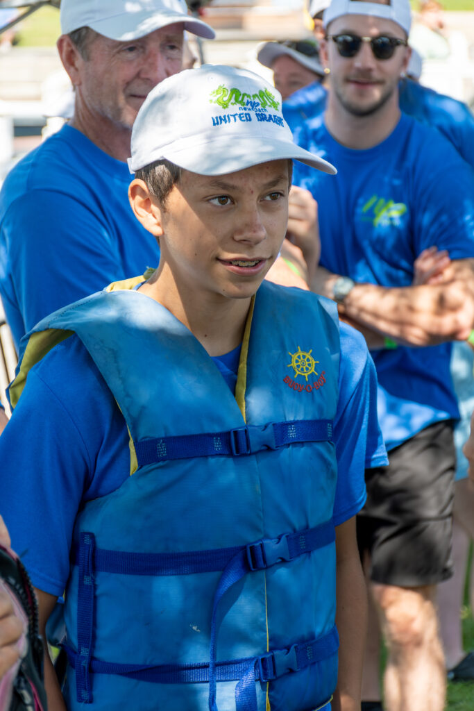 Picture of a young man wearing a New Path United Dragon hat and t-shirt smiling