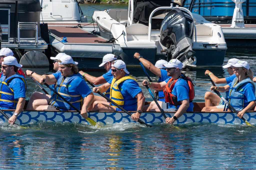 A dragon boat team paddling