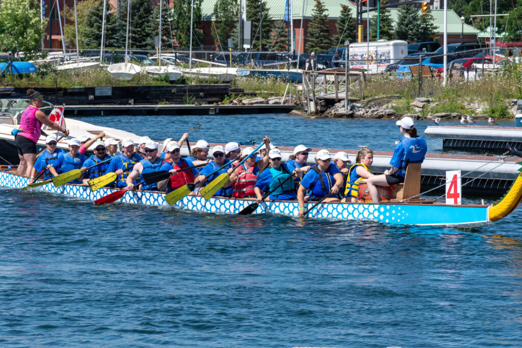 A dragon boat team paddling