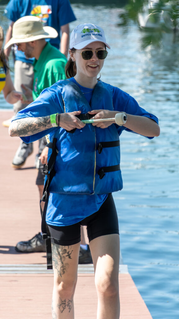 Picture of a women taking off her life jacket